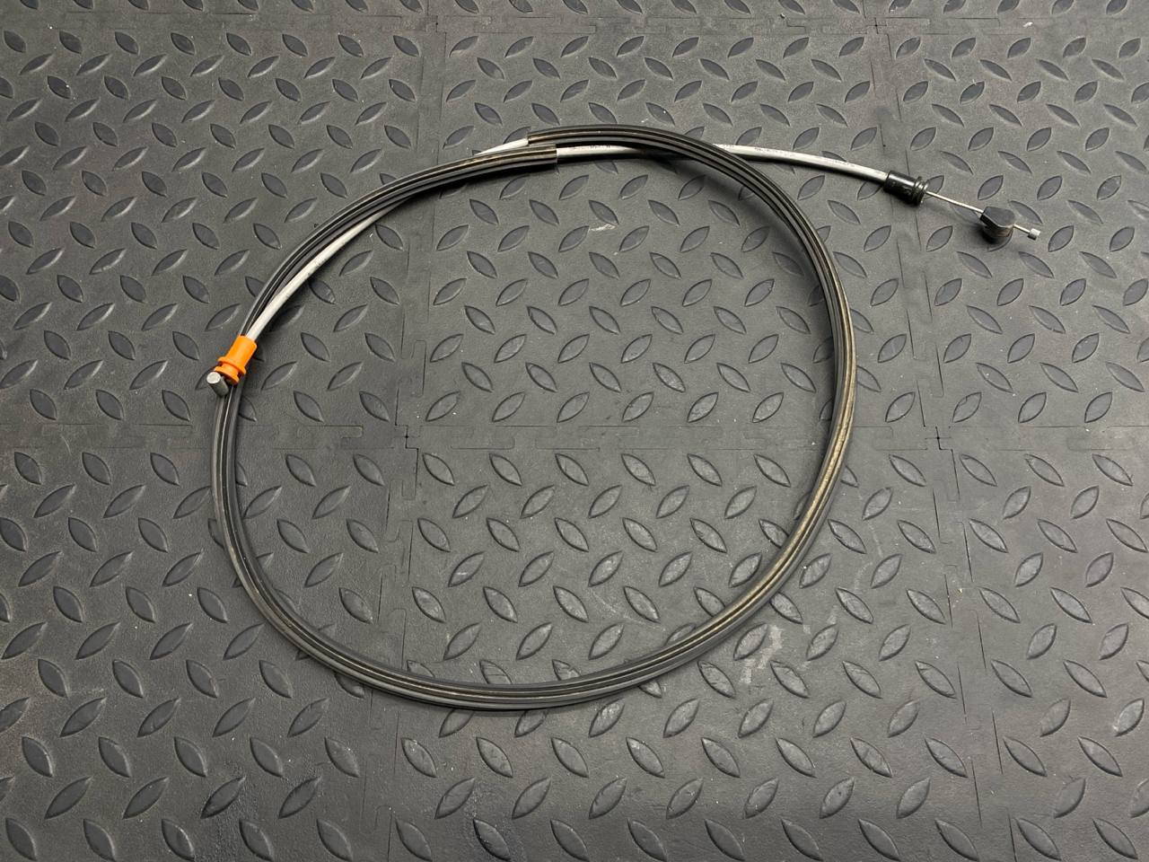 Трос замка двери багажника левый Ford Transit 2000-2006