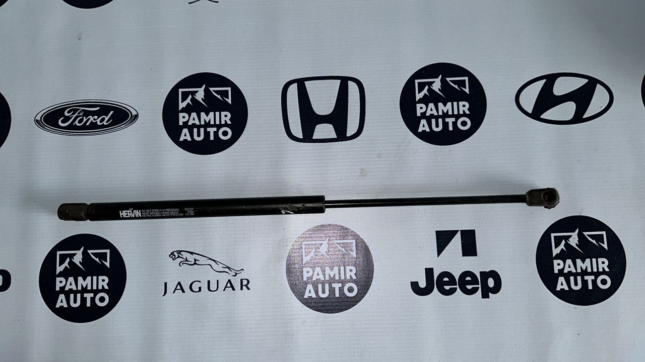 Амортизатор двери багажника Opel Astra/H 2004-2014