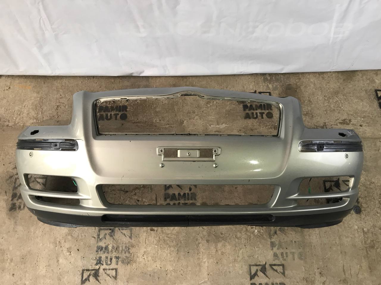 Бампер передний Toyota Avensis/2 2003-2009