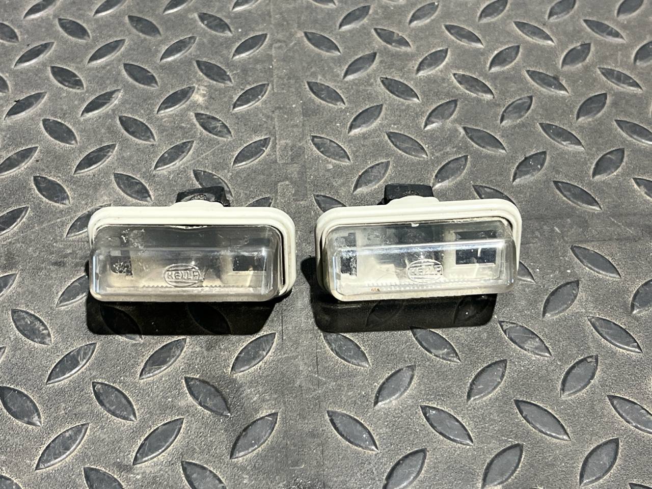 Фонарь подсветки номера Toyota Avensis/2 2003-2009