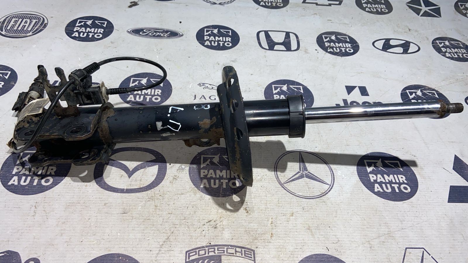 Амортизатор передний левый Opel Zafira/B 2005-2014